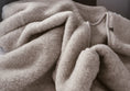 Load image into Gallery viewer, Grey thick, large and very warm pure merino wool blanket, labeled with Woolmark high quality tag. looks very warm, comfortable and cosy