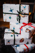 Load image into Gallery viewer, Beautifully packaged gifts with meticulous care, featuring Bamboshe gift wrapping adorned with green and red ribbons.