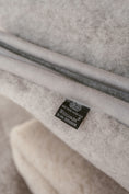 Load image into Gallery viewer, Grey thick, large and very warm natural pure merino wool blanket, labeled with Woolmark high quality tag. looks very warm, comfortable and cosy