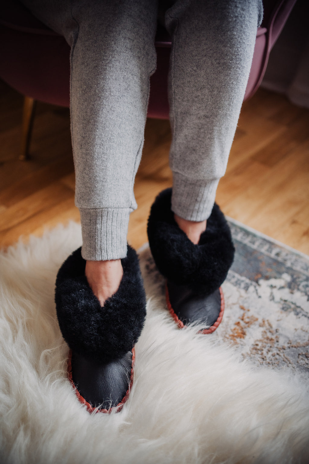 Warm and fluffy natural leather black sheepskin fur moccasins handmade in polish mountains.