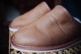 Load image into Gallery viewer, Close-up of fine stitching on soft leather men's slippers.
