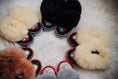 Load image into Gallery viewer, Assortment of kids' fluffy sheepskin slippers in various vibrant colors, adorned with beautiful and colorful embroidery.
