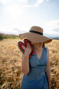 Load image into Gallery viewer, boho Woman in the middle of field holding her favourite folk, boho handmade felt woollen slippers
