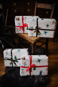 Load image into Gallery viewer, Beautifully packaged gifts with meticulous care, featuring Bamboshe gift wrapping adorned with green and red ribbons.

