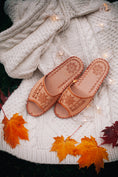 Load image into Gallery viewer, Handmade leather sandals with open toes, styled with a wool cardigan.
